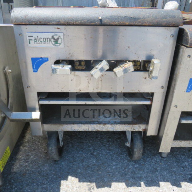 One Falcon Natural Gas 2 Burner on Casters, 18x50x22, stainless steel, used condition, Falcon logo visible.
