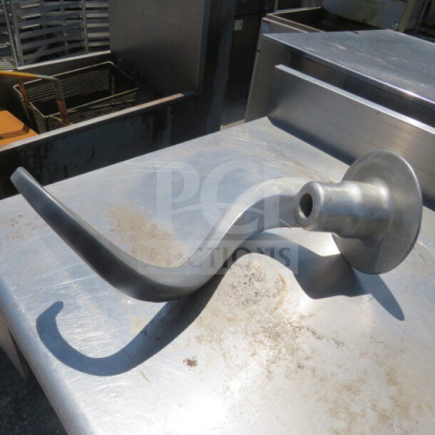 Metallic 60 Quart Hook, Model #TW60ED, shown on stainless steel surface. Appears in good condition. Used in industrial mixers.