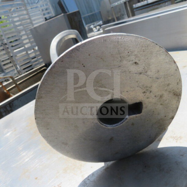 One 60 Quart Hook #TW60ED, industrial-grade, metal, visible wear, flat circular end, sturdy build.