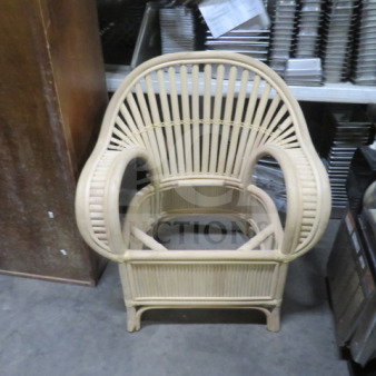 New rattan armchair without seat, intricate woven design, beige hue, sturdy frame, ideal for decorative purposes.