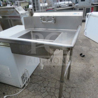 Regency stainless steel dirty side dishwasher table, 35.5x30 inches, features integrated sink, sturdy construction, used.