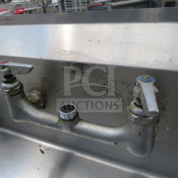 Regency stainless steel dirty side dishwasher table, 35.5x30 inches, used condition with visible wear.
