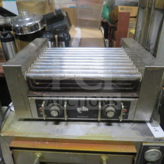 Star Hot Dog Roller, Model 25, 120 Volt, 23x17x10.5 inches. Features control knobs, Star branding. Used condition.