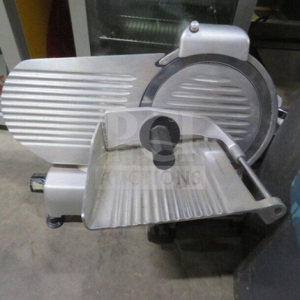 Beswood Model 250 food slicer, 120 Volt. Stainless steel construction, excellent condition, features adjustable thickness knob.