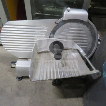 Beswood Model 250 food slicer, 120 Volt. Stainless steel construction, excellent condition, features adjustable thickness knob.