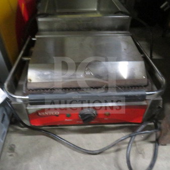 Avantco Panini Press, 120V, 18x15x9, stainless steel, grooved plates, used condition, with adjustable temperature knob.