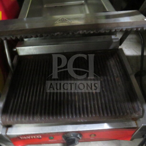 Avantco Panini Press, 120V, 18x15x9 inches. Features ribbed plates for grilling. Good condition with visible branding.