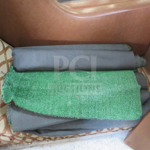 Assorted green turf rolls in varying sizes. Light wear, suitable for landscaping or decoration.