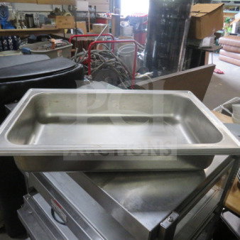 Full-size stainless steel chafer base pan, model 3XBID, in good condition, shown in a storage setting.