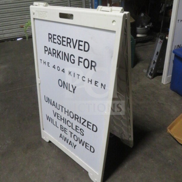 Signcade sidewalk sign, 26.5x42 inches, for "Reserved Parking for The 404 Kitchen." White, A-frame, good condition.