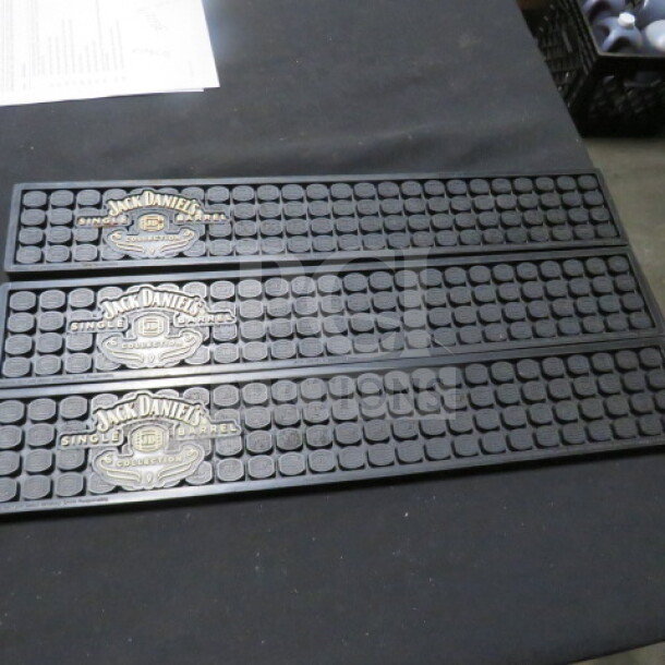 Jack Daniels bar mat, set of three, featuring brand logo and "Single Barrel" label, black rubber, new condition.