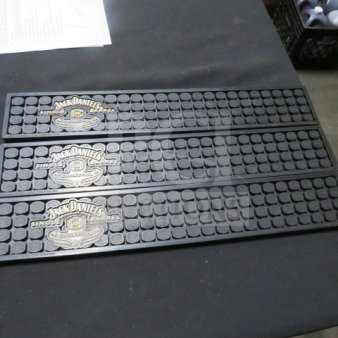 Jack Daniels bar mat, set of three, featuring brand logo and "Single Barrel" label, black rubber, new condition.