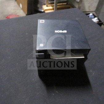 Epson Thermal Printer, Model M335B. Black finish, top-loading paper. Slight surface wear visible.