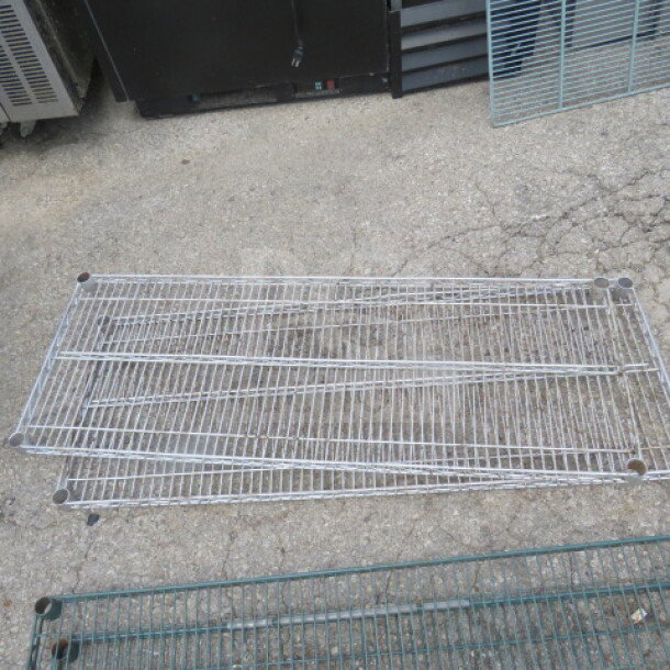 48x18 Metro shelf, silver metal, used condition, wire grid design, ideal for storage. Model: 2XBID.
