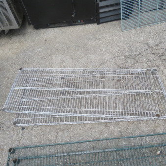 48x18 Metro shelf, silver metal, used condition, wire grid design, ideal for storage. Model: 2XBID.