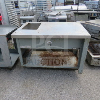 One Duke steam table, model SUB-HF-R48, 49x34x34 inches, with under shelf, visible wear and rust.