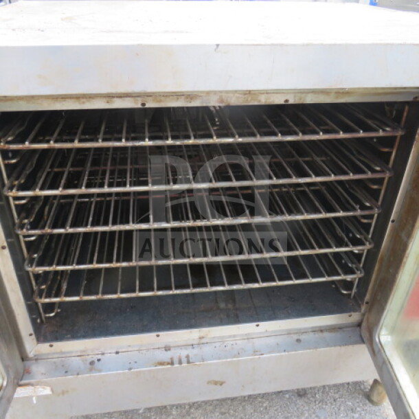 Vulcan VC4GD natural gas convection oven, 40x31x32, no handles, used condition, visible racks inside.