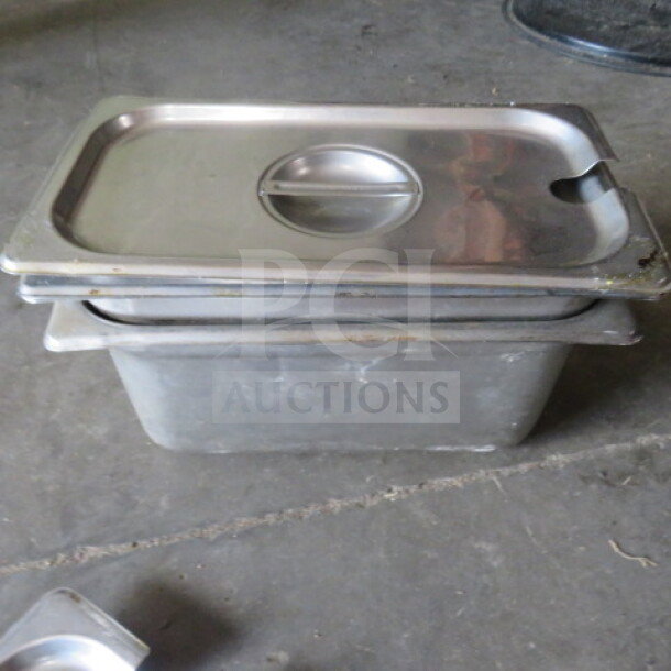 1/3 Size 6-inch deep hotel pan with lid, stainless steel, used condition. Contains visible wear, model 2XBID.