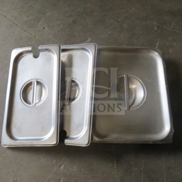 Three assorted stainless steel lids with handles, in good condition. Suitable for various container sizes.
