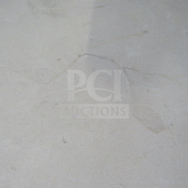 White round laminate table, 36x30 inches, with pedestal base. Smooth surface, modern design. Good condition.