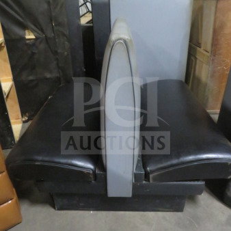 Black and gray double-sided cushioned booth in good condition, featuring vinyl upholstery and sturdy construction.