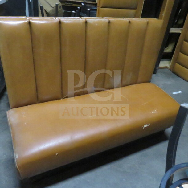 Brown single-sided cushioned booth with vertical stitching, showing wear on upholstery, suitable for restaurant or café use.