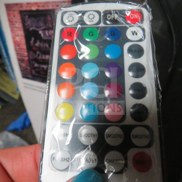 Everbilt 16x24 LED Message Board with remote control, new condition. Features multicolor and flash settings.