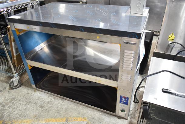 Brand new Prince Castle DHB2PT-44D holding bin, 2 shelves, 4 pan capacity, 208-240V, with protective film.