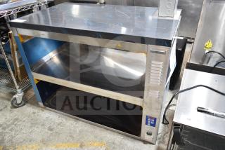 Brand new Prince Castle DHB2PT-44D holding bin, 2 shelves, 4 pan capacity, 208-240V, with protective film.