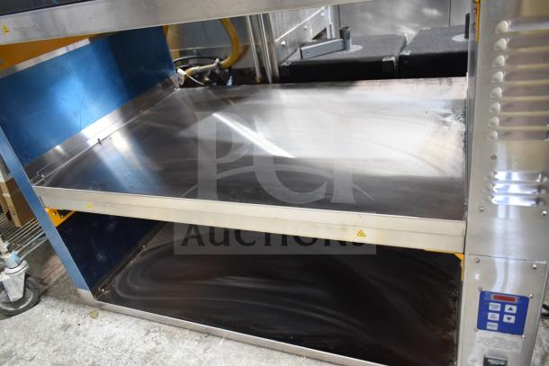 BRAND NEW Prince Castle DHB2PT-44D holding bin with two shelves for four pans, stainless steel, 208-240V. Scratch and Dent condition.