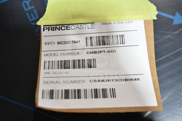 "Prince Castle DHB2PT-44D label showing model, serial number, and voltage information; made in the USA."