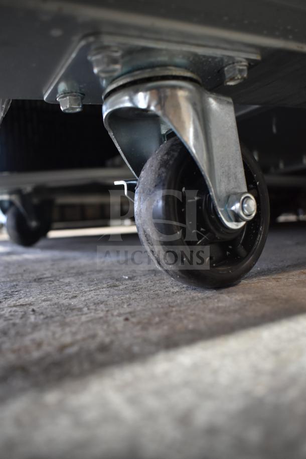 Auction image of Avantco 178A49RHC commercial cooler caster. Slightly scratched, durable metal wheel. Brand new condition.