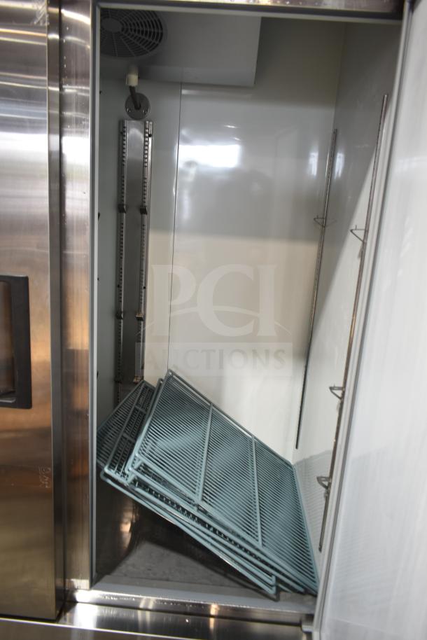 Brand new Avantco 178A49RHC commercial 2-door reach-in cooler interior with shelves, 115V, scratch and dent condition.