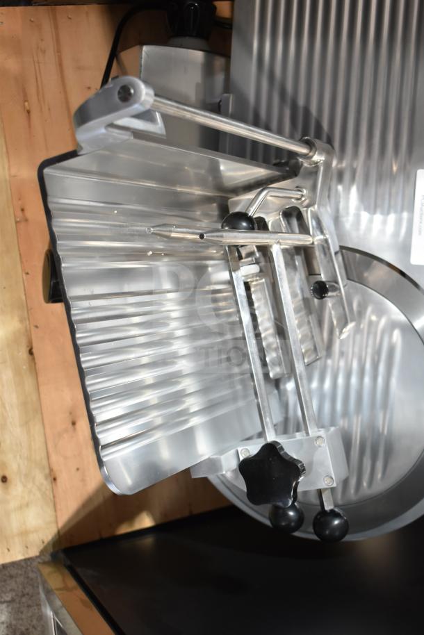 Brand new Avantco ASM0013 13" meat slicer, medium-duty, automatic/manual, with blade sharpener, 3/4 hp, 120V.