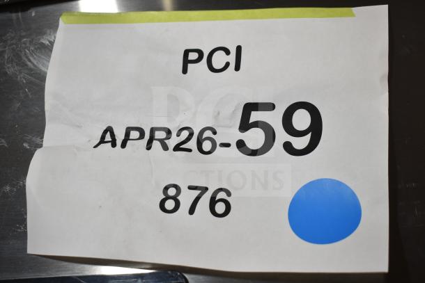 White paper with "PCI APR26-59 876" in black text and a blue dot, against a metallic background.