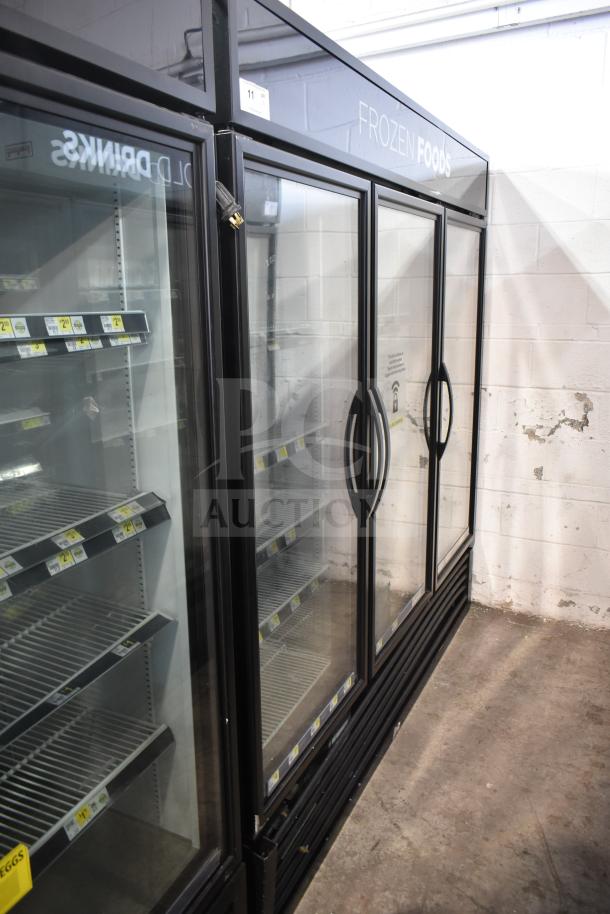 2019 True GDM-72F-HC Commercial 3 Door Reach In Freezer Merchandiser, black frame, glass doors, shelves shown, good condition.