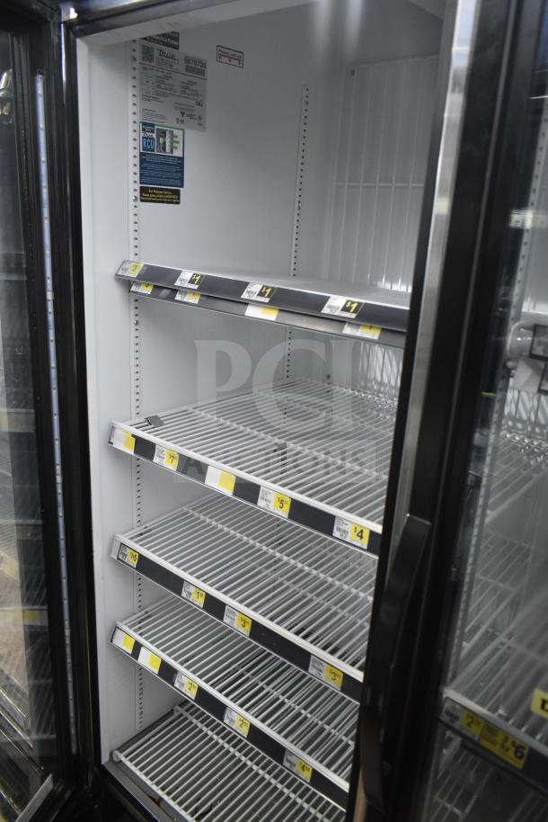2019 True GDM-72F-HC 3-door commercial freezer with glass doors, adjustable shelves, and visible labeling. Excellent condition.