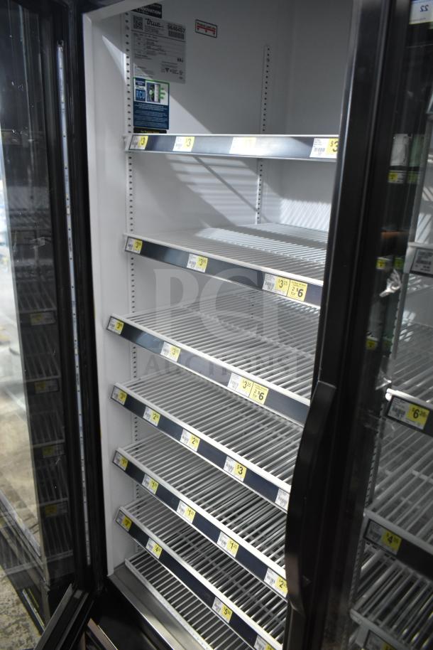 2019 True GDM-72-HC commercial 3-door cooler in excellent condition. Shelving intact, 115 volts, 1 phase.