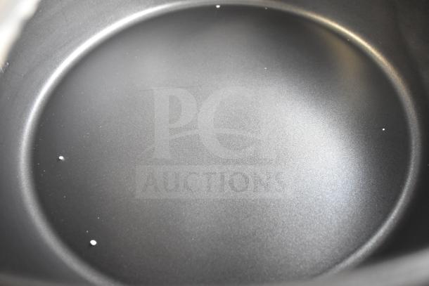 Brand new Avantco 177RCB90 electric rice cooker interior, 90-cup capacity, minor scratches visible, 240 volts, 1 phase.