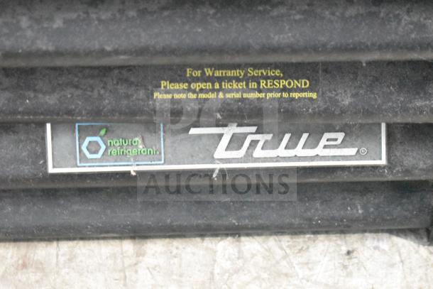 2019 True GDM-72-HC cooler, 3-door reach-in merchandiser. Features True logo, 115 volts, 1 phase. Warranty info visible.