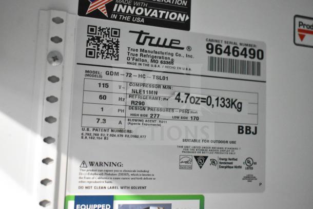 2019 True GDM-72-HC, 3 Door Cooler Merchandiser label; model, voltage, refrigerant, and safety info visible.