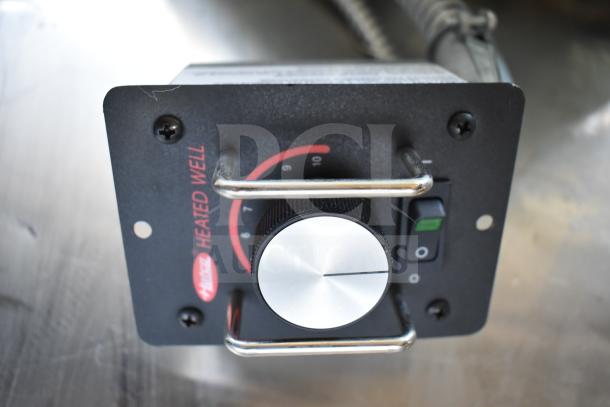 Hatco HWBI-FULD hot food well control panel, showing temperature dial and on/off switch. "Heated Well" label visible.