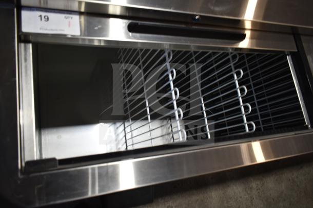 Brand new Avantco 178HBB95HC 95" black bottle cooler with sliding lids, 115V, 1 phase. Scratch and dent condition.