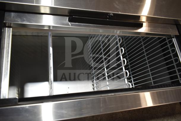 Brand new Avantco 178HBB95HC 95" black bottle cooler with sliding lids. Commercial use, 115V, 1 Phase. Scratch and dent.