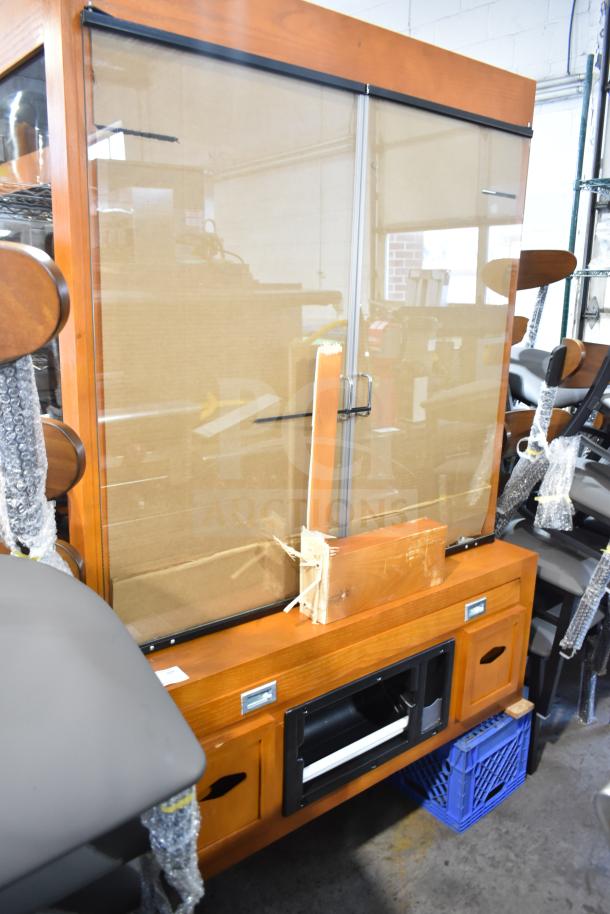 Avantco 178HBB95HC wood pattern dry bakery display case, new with scratches and dents, glass doors, storage below.