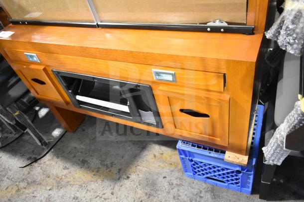 Brand new Avantco 178HBB95HC wood pattern bakery display case, scratch and dent, showcases pastries or donuts.