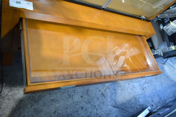 Avantco 178HBB95HC wood pattern bakery display case, new with scratches; clear front, label indicates auction lot 20.