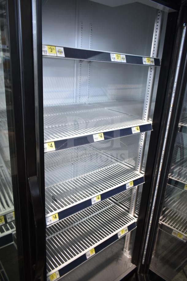 2019 True GDM-72-HC commercial 3-door cooler merchandiser, shelving visible, clean condition, 115 volts, 1 phase.