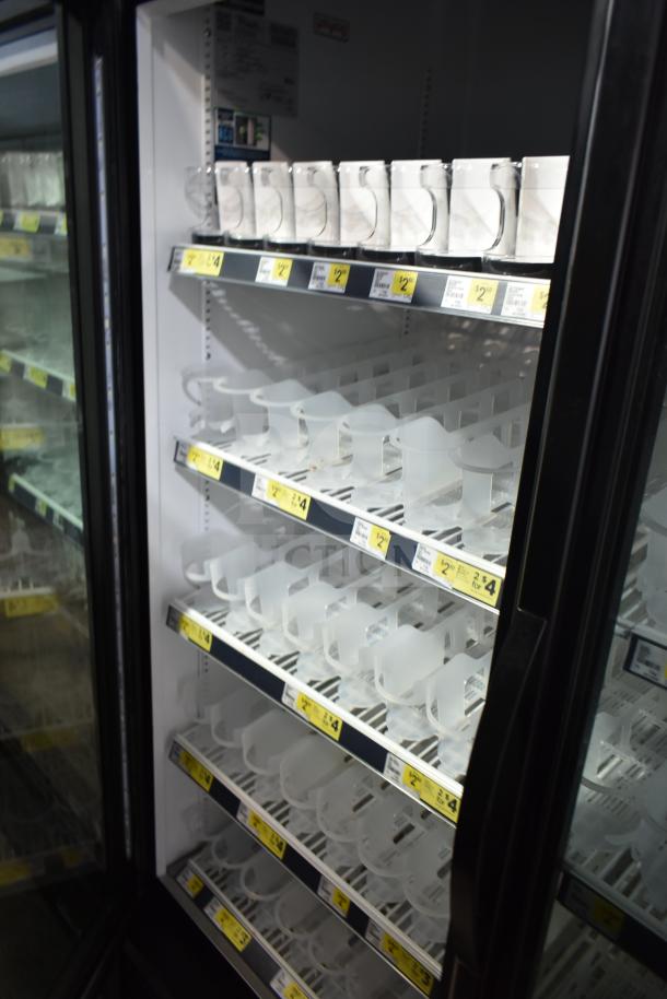 2019 True GDM-49-HC commercial cooler, 2-door, glass front, adjustable shelves, energy-efficient, clean interior.