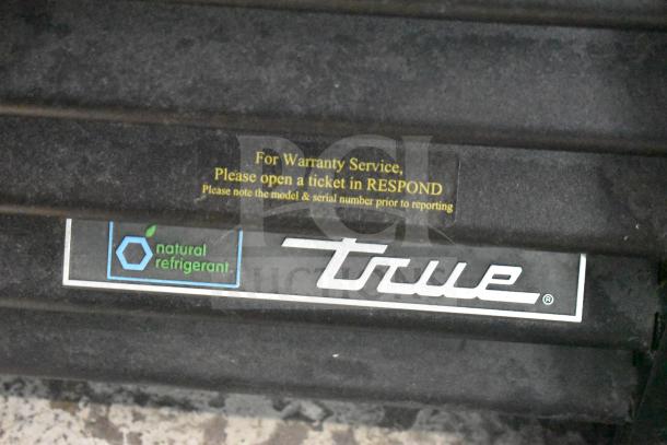 2019 True GDM-49-HC commercial cooler, natural refrigerant label, warranty service note visible, 115 volts, 1 phase.